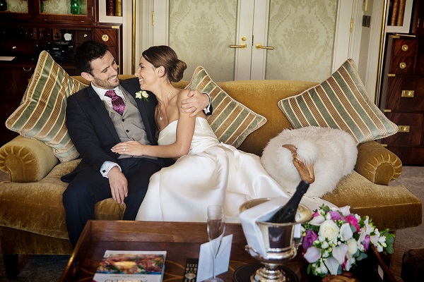 Image of A Wedding Couple Holding Hands With Each Other in Royal Suite At The Grand Hotel.