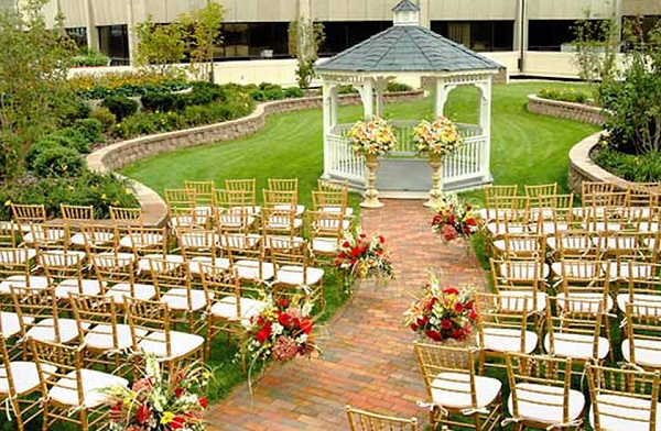 Image of A Beautiful Floral Decorations for a wedding ceremony in a hotel’s garden.